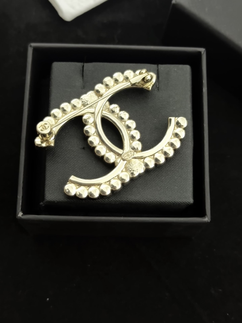 Ch**el brooches